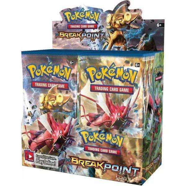 Pokémon BreakPoint trading card game booster box display with packs and Gyarados artwork